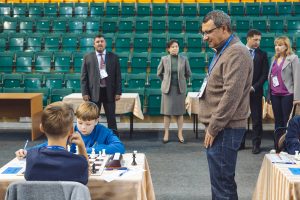 Vasily Filipenko watches the game of Georgi Ryabov (RUS) and Filip Haring (SVK)